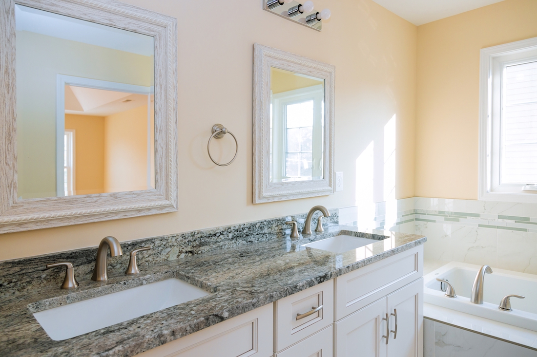 Granite counter in bathroom with two sinks